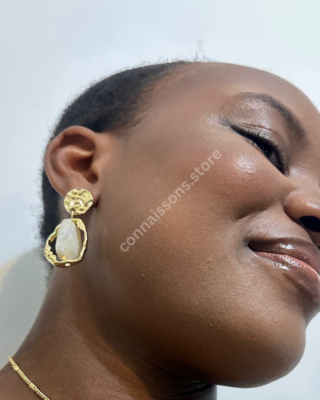 Rotating White Stone on Gold Earrings